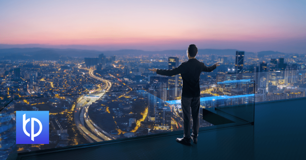man overlooking a city through a building window